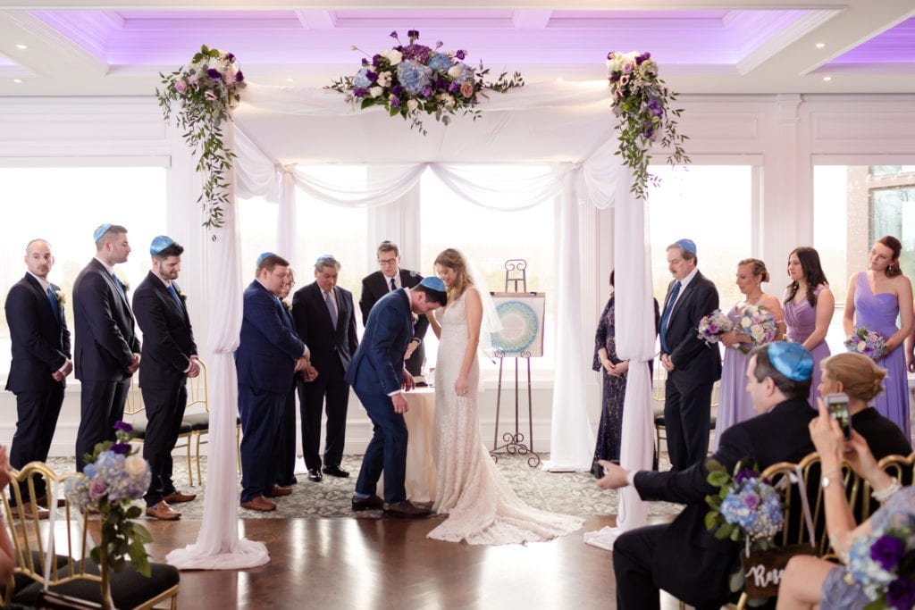 bride and groom breaking the glass