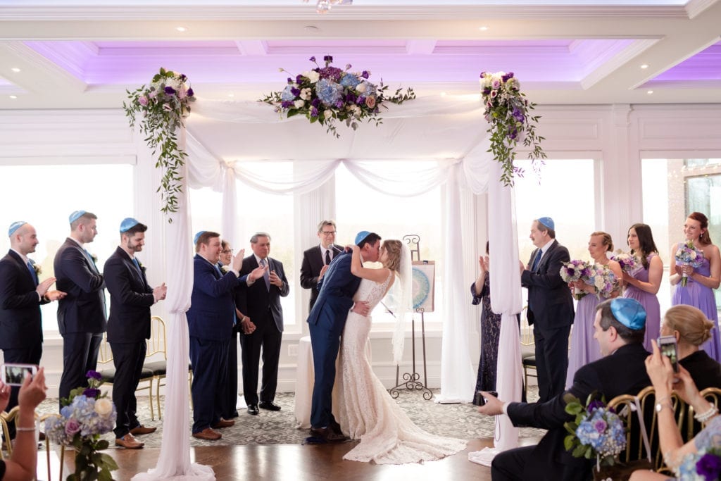 bride and groom first kiss