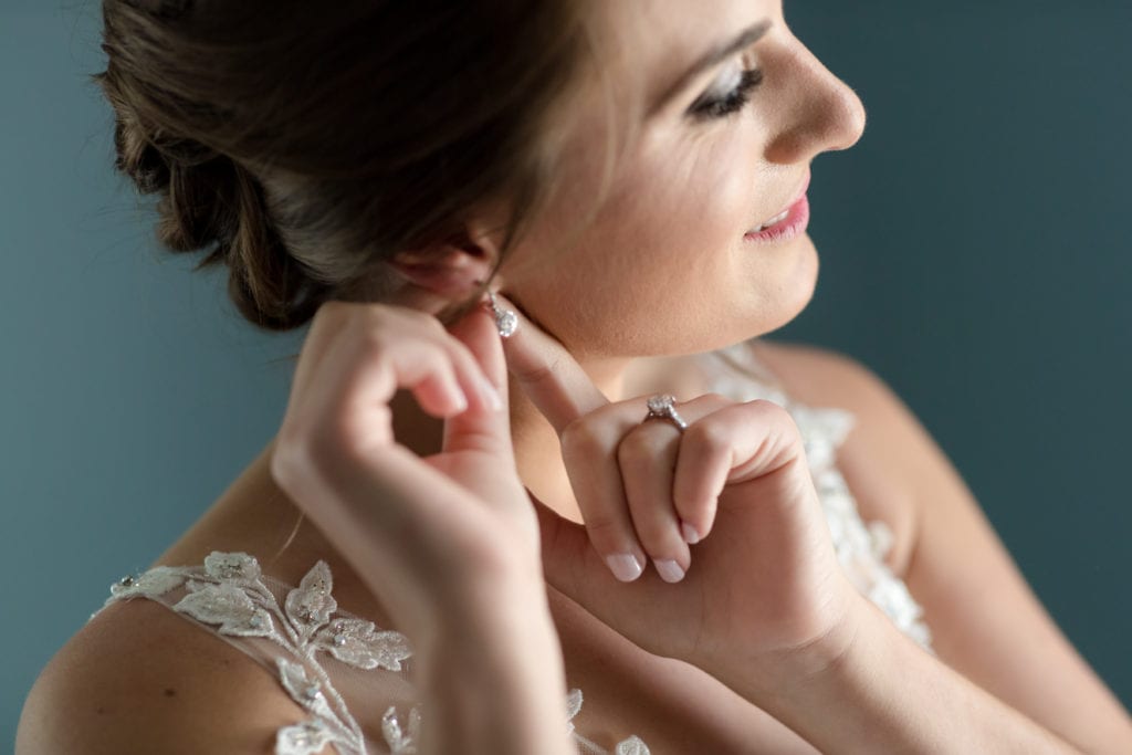 up close shot of brides earrings, wedding day earrings