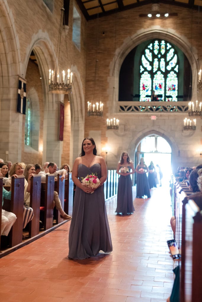 bridal procession. bridesmaids walking down the aisle