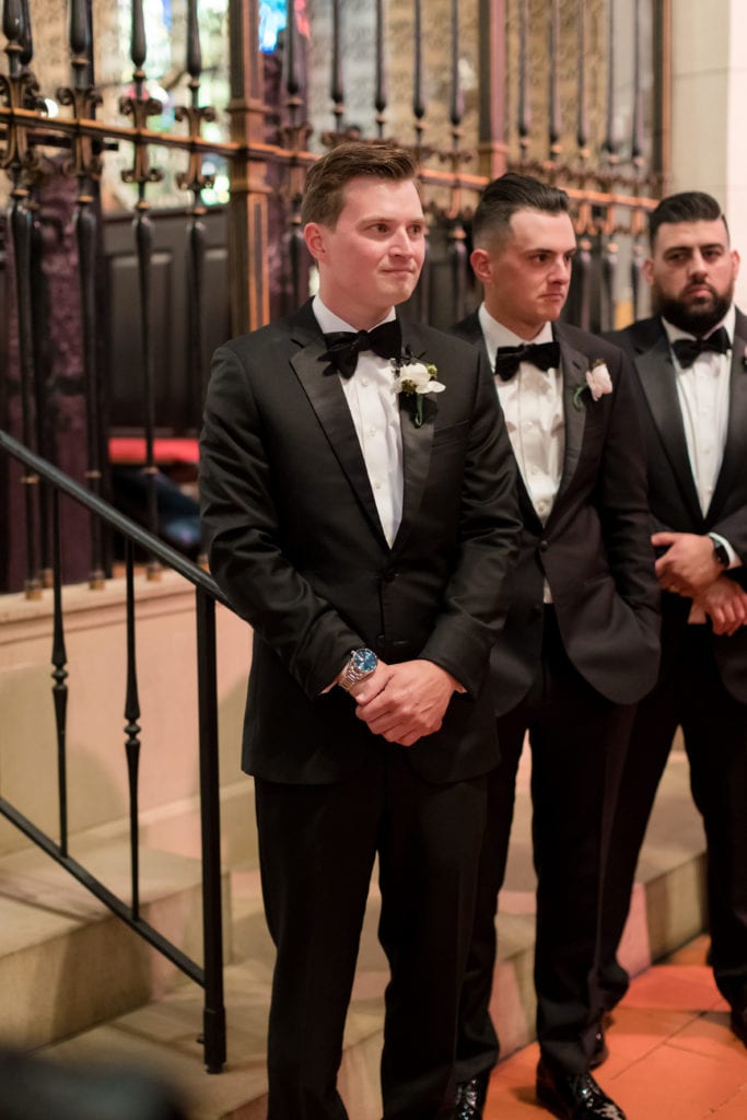 groom awaiting his bride to walk down the aisle