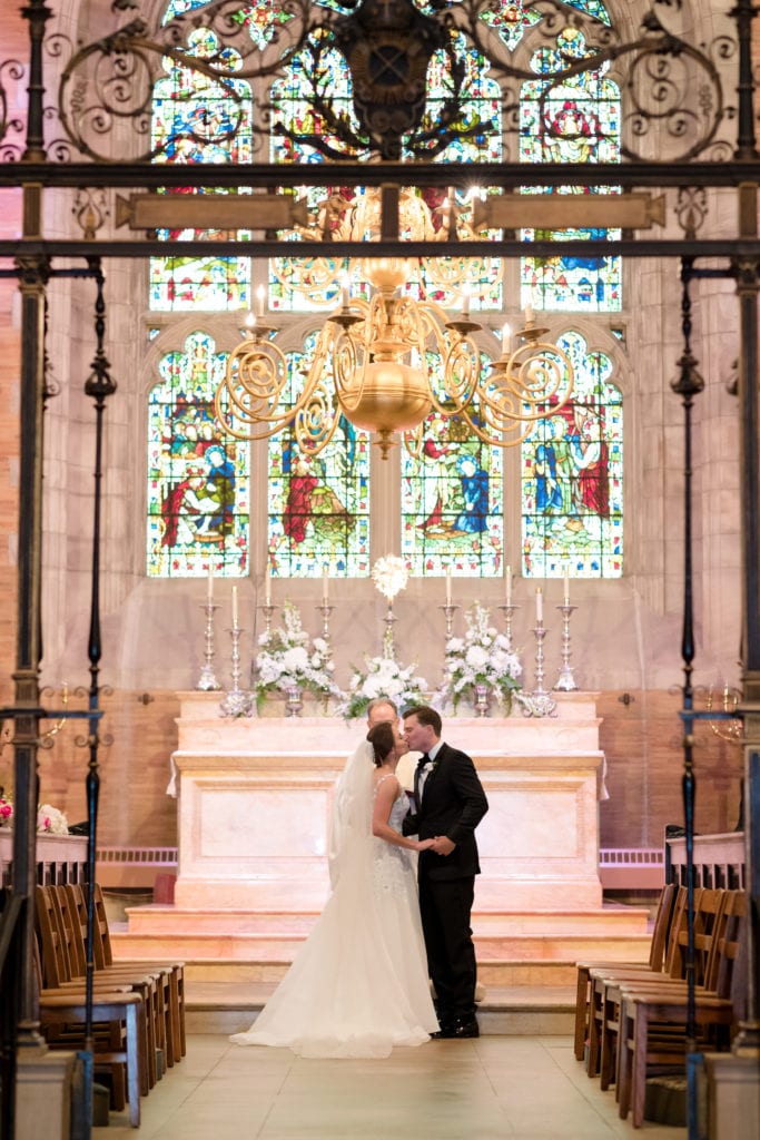 bride and grooms first kiss