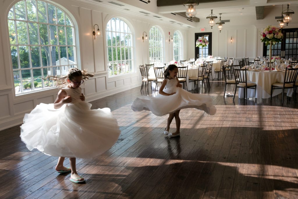 flower girls dancing at wedding reception