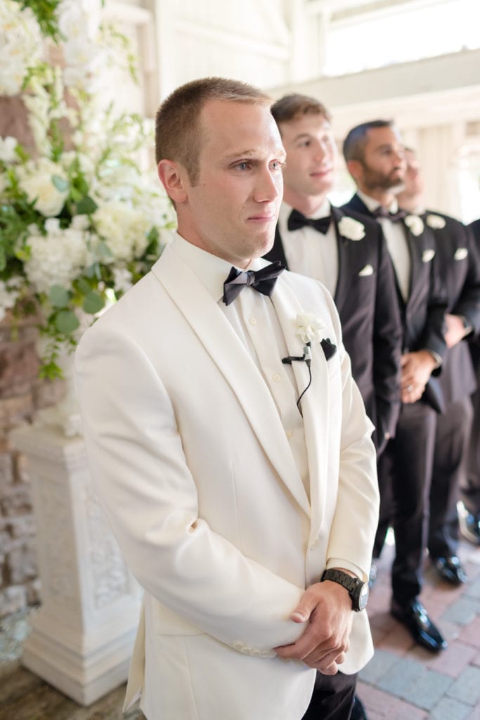 Groom seeing his bride walk down the aisle