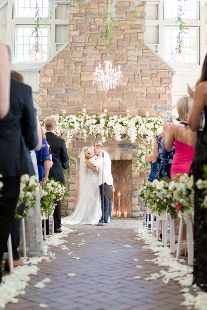 bride and grooms first kiss