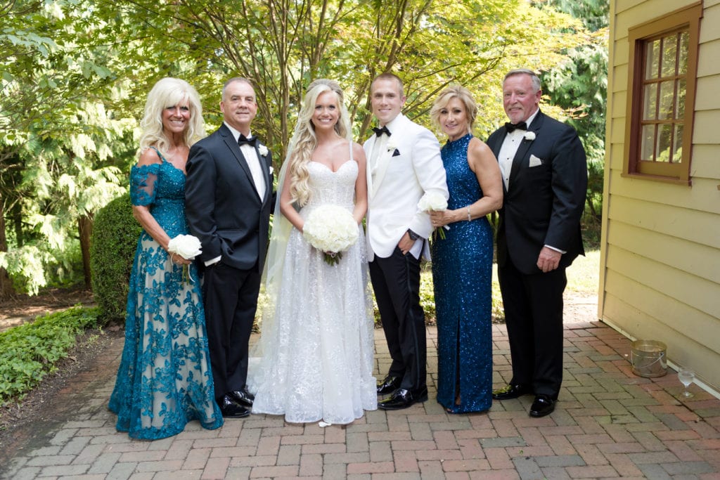 bride and groom with their parents