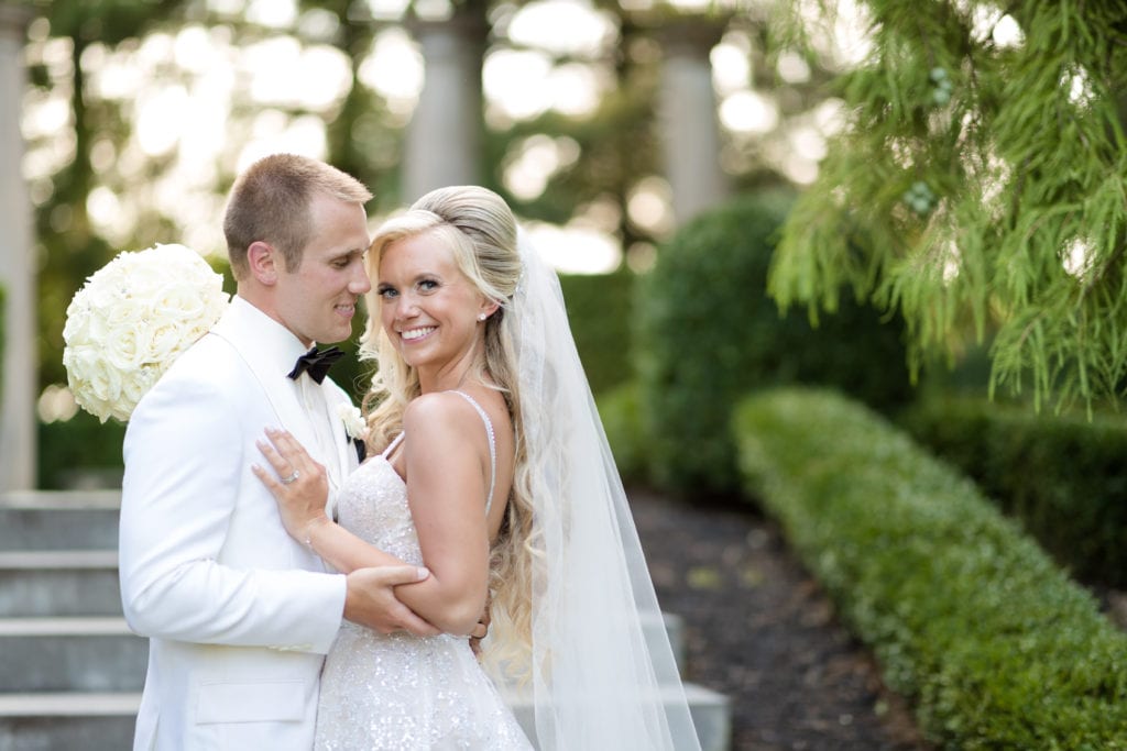 bride and groom in all white