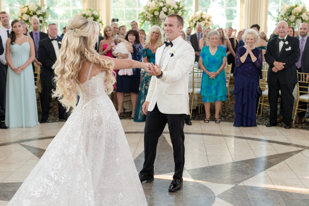 groom twirling bride