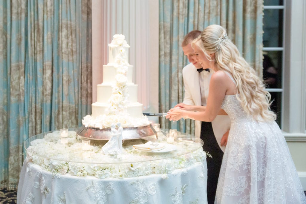 bride and groom cutting the bake works cake