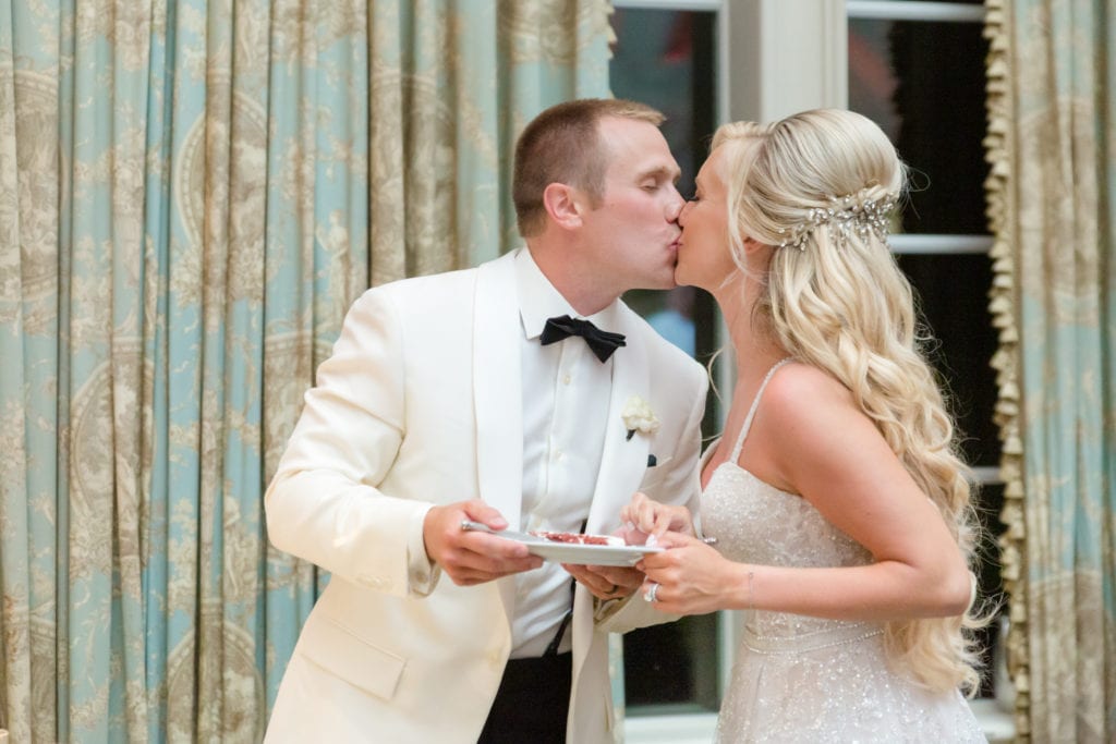 bride and groom cut the cake