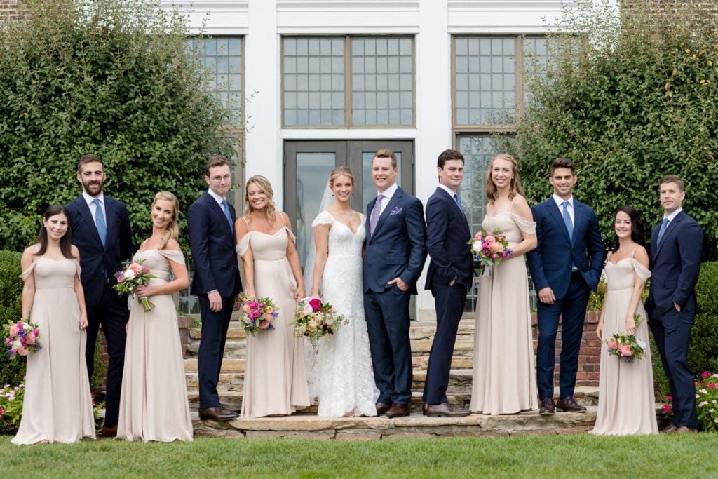 bride and groom with their wedding party