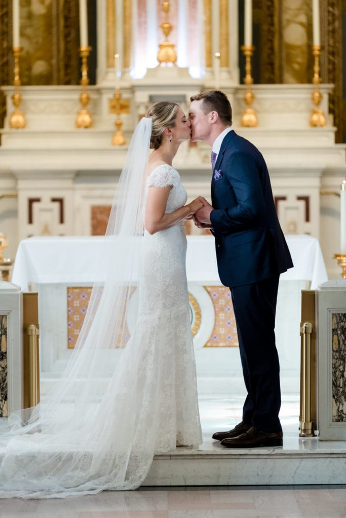 bride and grooms first kiss