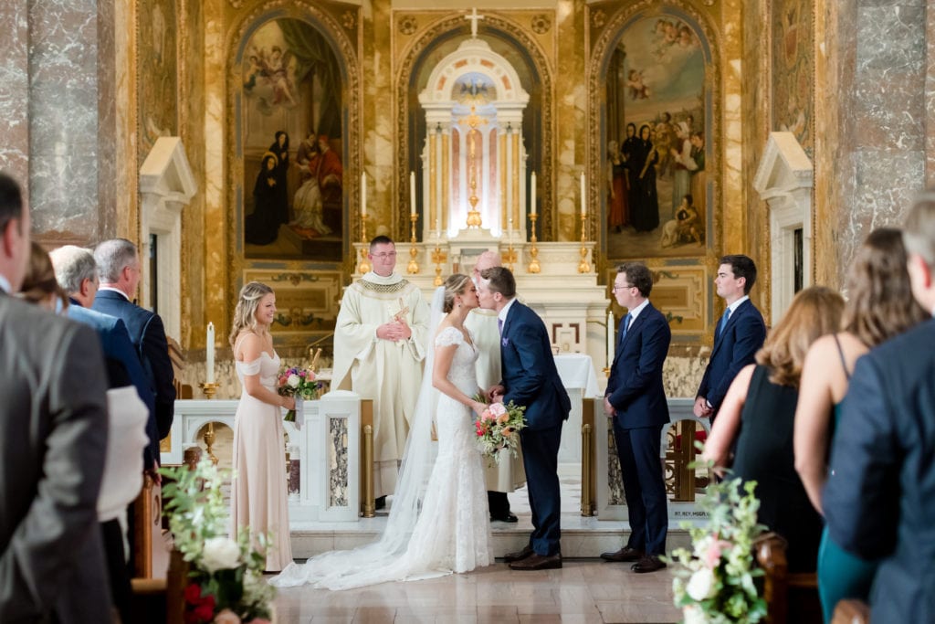 groom kisses his bride