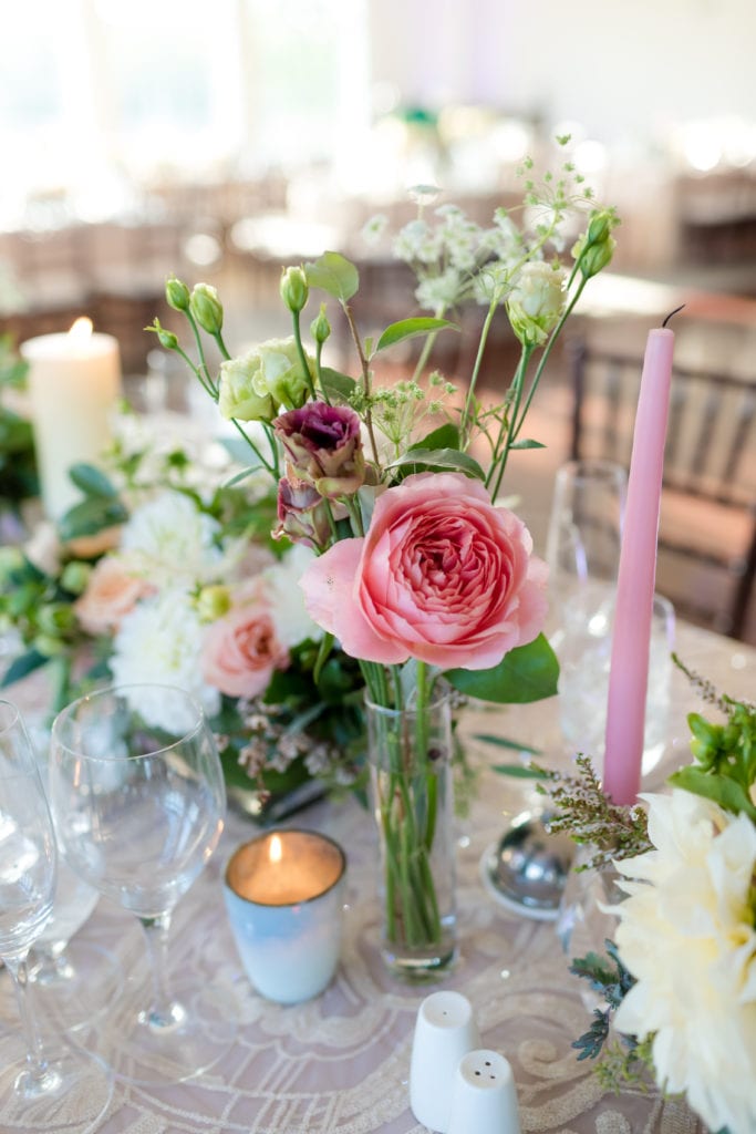 hot pink centerpiece flowers and candles