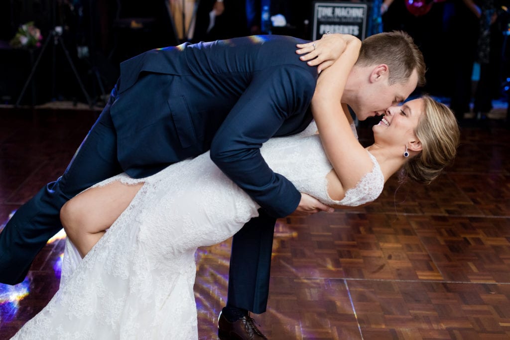 groom dipping bride during first dance