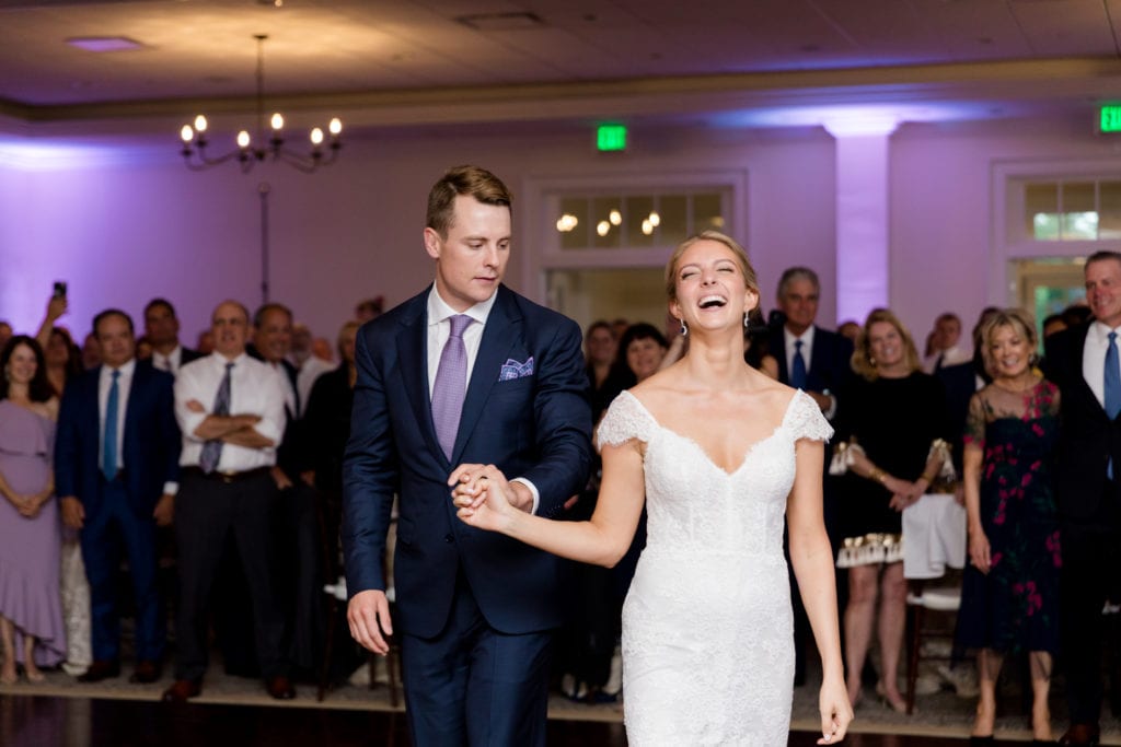 bride and groom having great time at their wedding reception