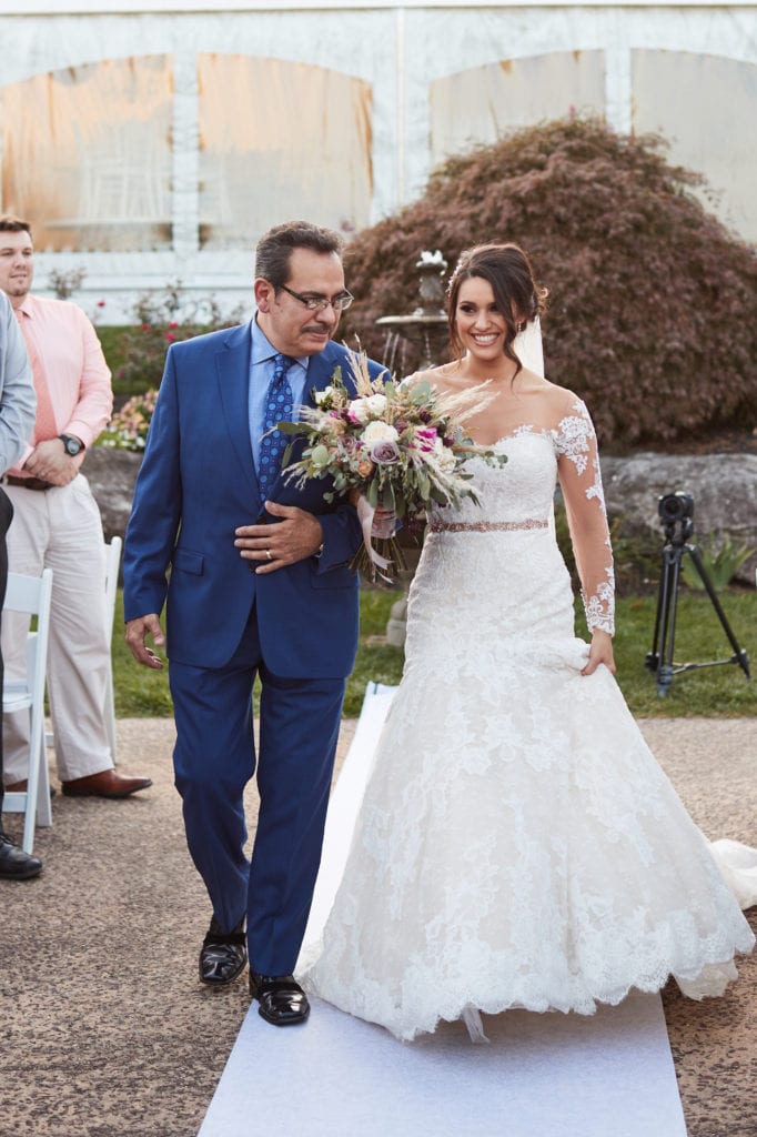 father walking his daughter down the aisle, wedding procession