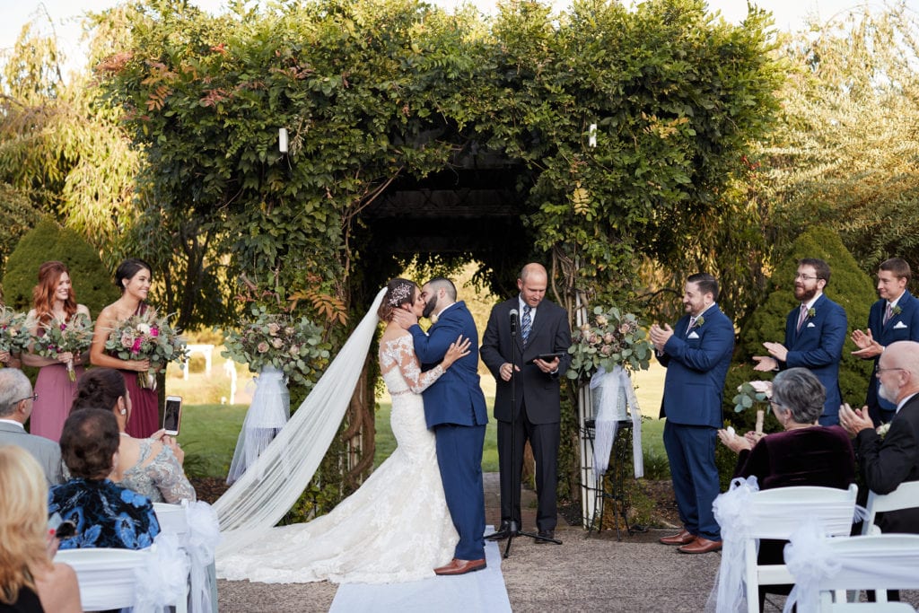 bride and grooms first kiss