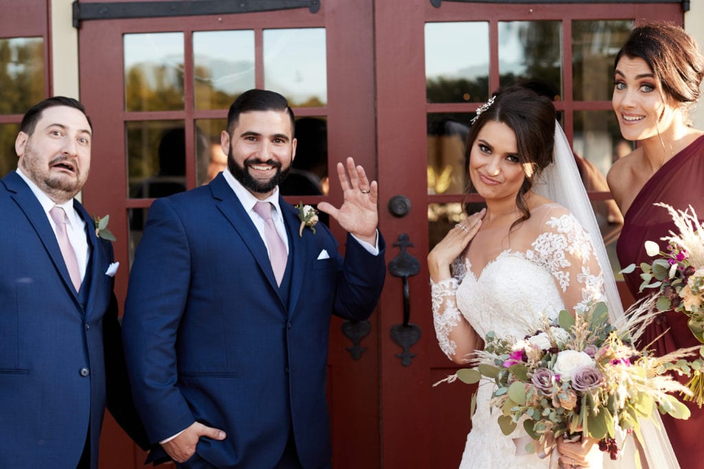 bride and groom with the best man and maid of honor