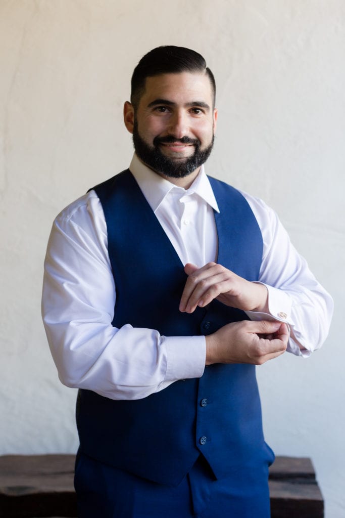 Groom in mens wearhouse suit, blue suit vest