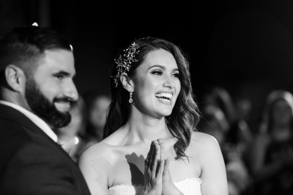 bride and groom listening to speeches