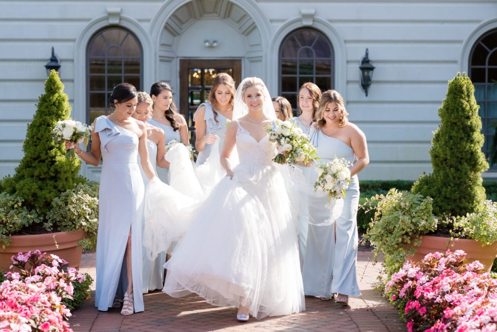 bride outside of Ashford Estate with her bridesmaids