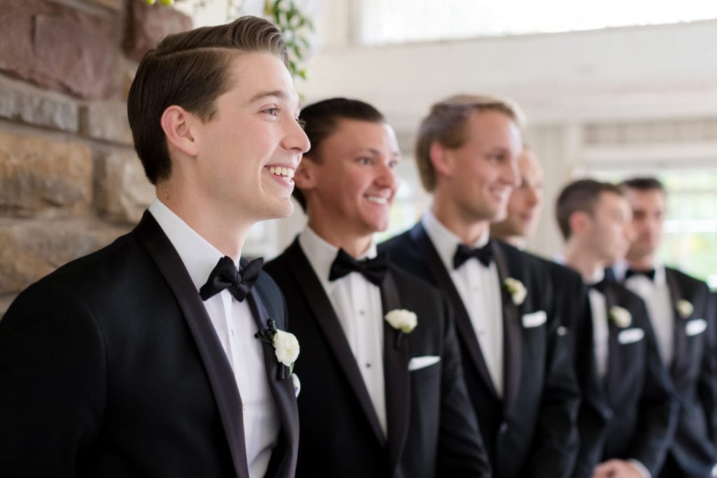 groom waiting on his bride to walk down the aisle