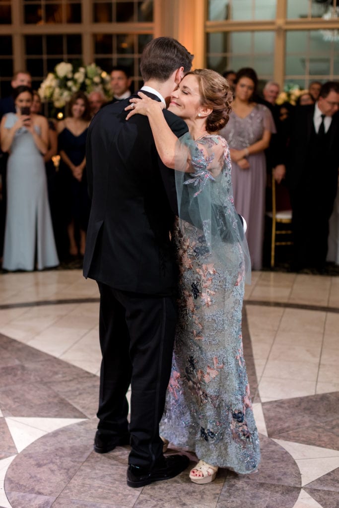 groom dancing with his mom at wedding reception