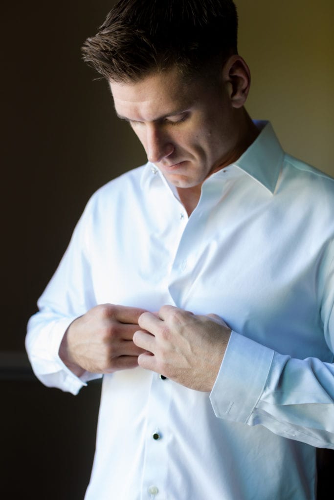 groom getting ready on wedding day