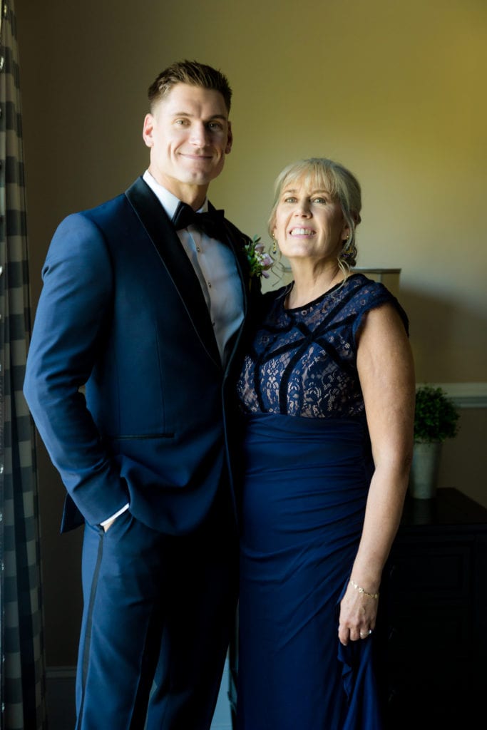 groom and his mother on wedding day, Navy and black tuxedo