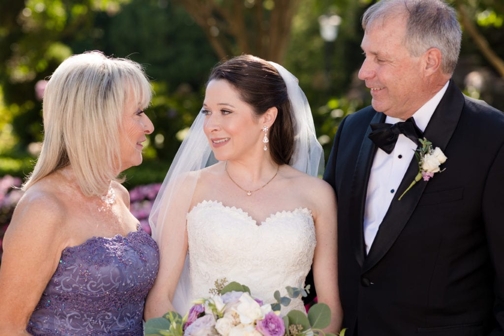 bride and her parents on wedding day