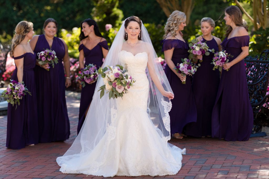 bride with her bridesmaids behind her