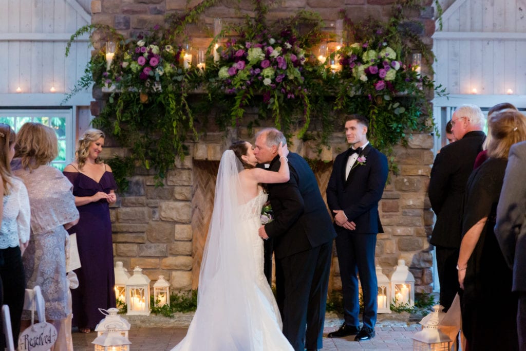 brides father giving her away on her wedding day