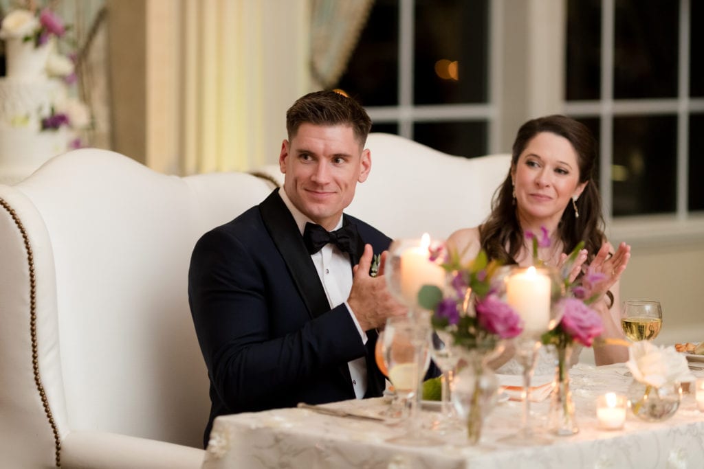 bride and groom at sweetheart table