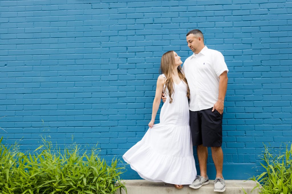 Fun, creative blue brick wall - engagement session - Austin Texas