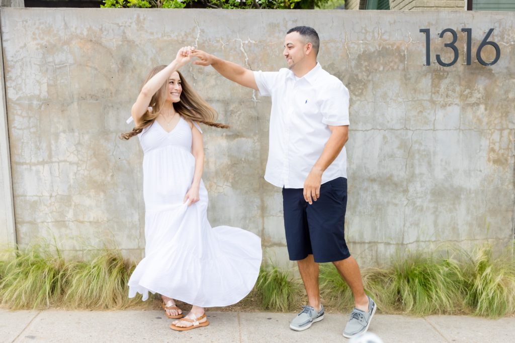 twirling engaged couple