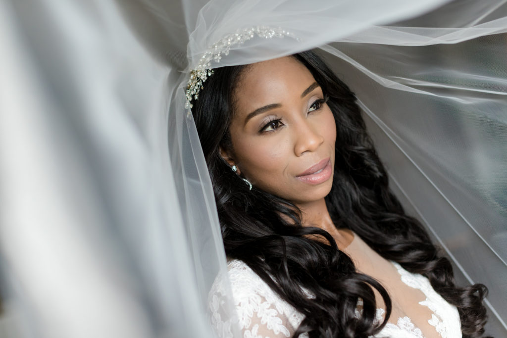 veil solo portrait black African American elegant bride. Photo by Vanessa Joy Photography