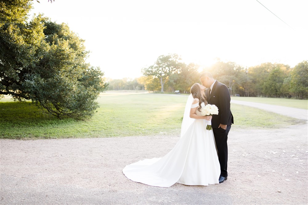 bride and groom portrait in garden. Photo by Vanessa Joy Photography