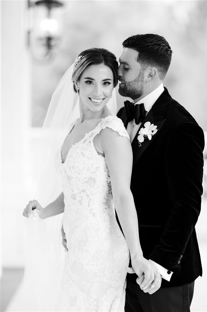 Black and white photo of bride and groom at Austin Texas modern luxurious wedding venue. Photo by Vanessa Joy Photography