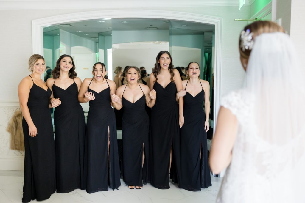 Bridesmaids' first look at the bride, bridal preparations