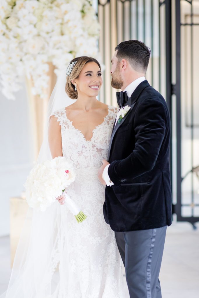 bride and groom lovingly stares at each other in the wedding hall at the Shadowbrook At Shrewsbury mansion