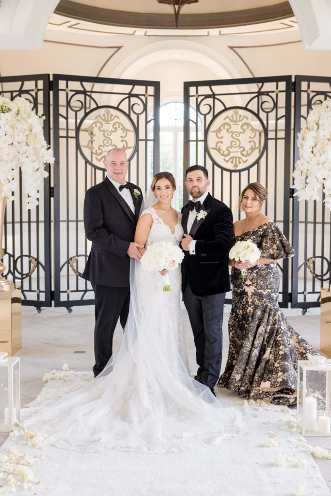 bride's parents with the couple