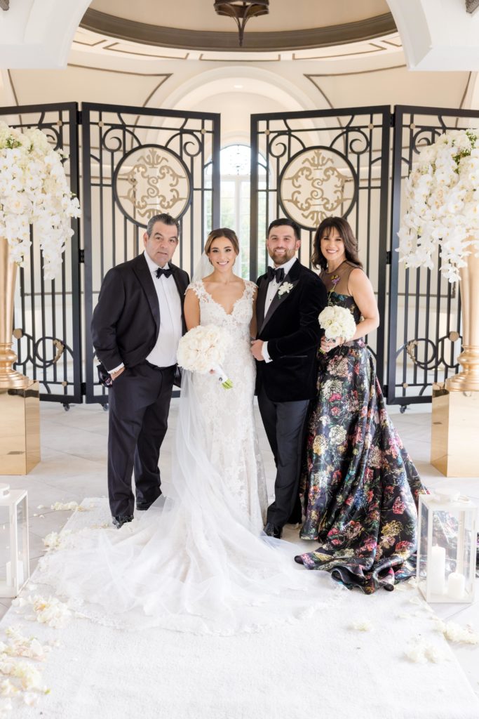 groom's parents with the couple