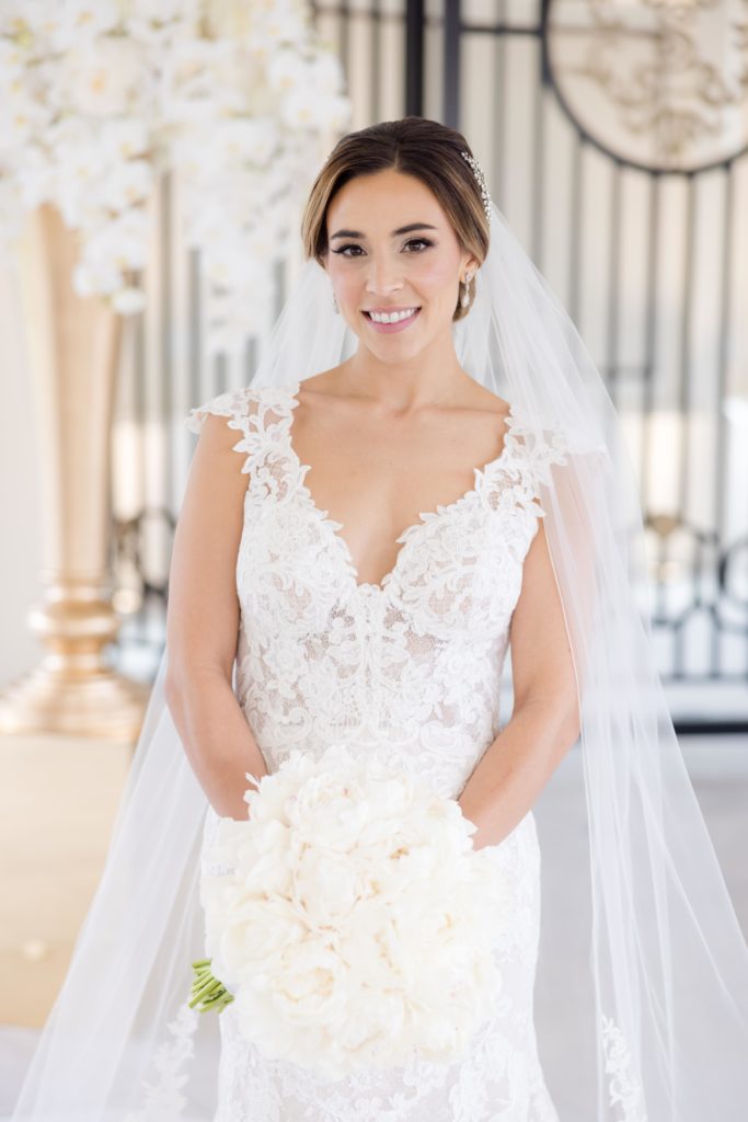 Bride's look complete with Konstantinos Floral Design bouquet