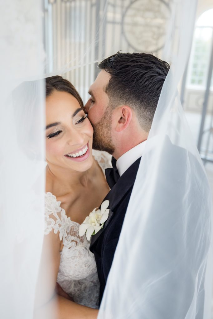 wedding portraits, Maggie Sottero Designs wedding gown, lace-edged veilclassic tux