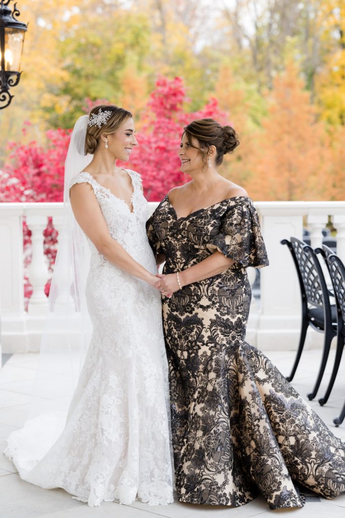 bride with her mother, lace beaded wedding gown, geometrical dress