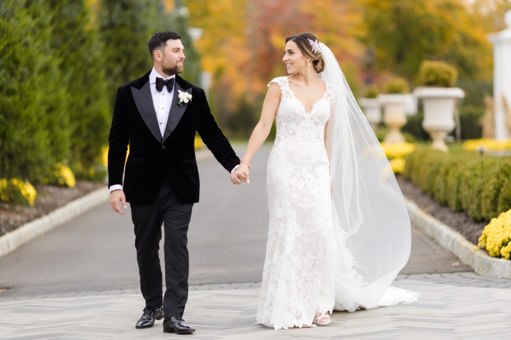 Bride and groom stare lovingly at each other, Wedding portraits, Maggie Sottero Designs wedding gown, classic tux