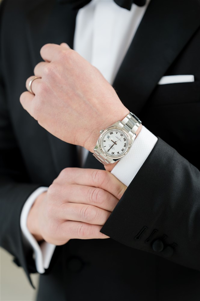 groom's watch and wedding band