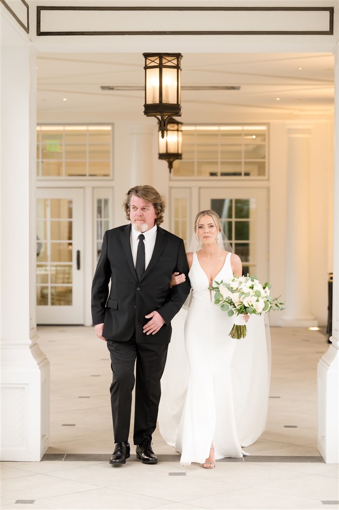 bride walking down the aisle with father