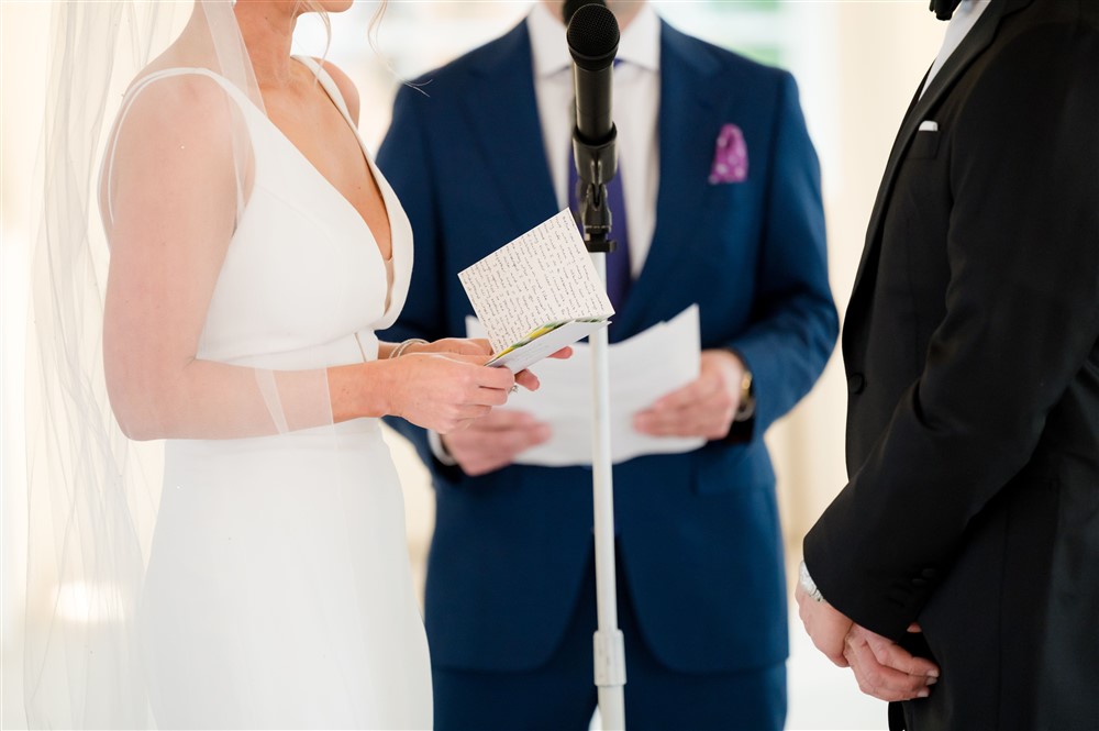 bride reading wedding vows